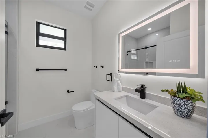 Full bathroom featuring vanity and a shower