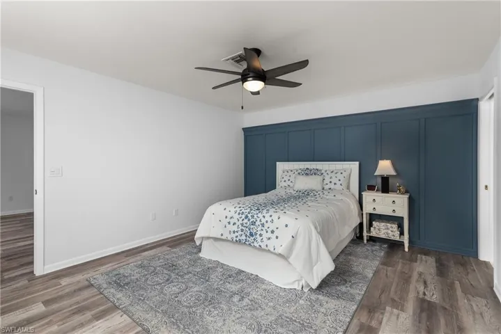Bedroom featuring a ceiling fan and wood finished floors