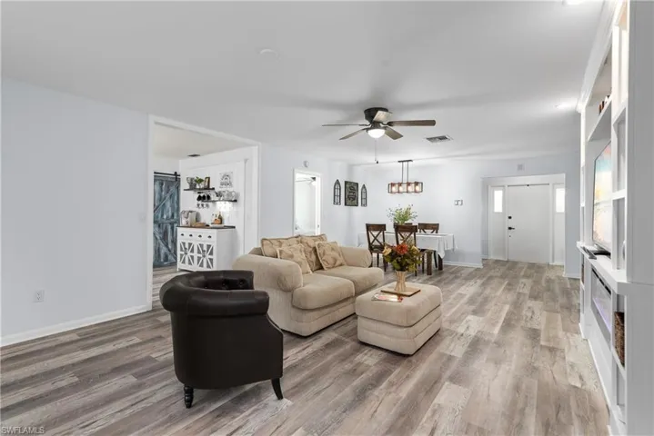Living room with wood finished floors and ceiling fan