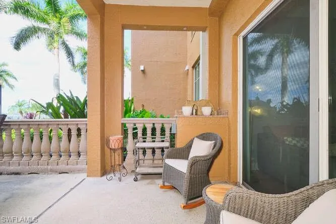 Spacious patio with several seating options and view of pool and river!