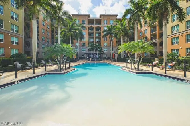 Community pool featuring a patio