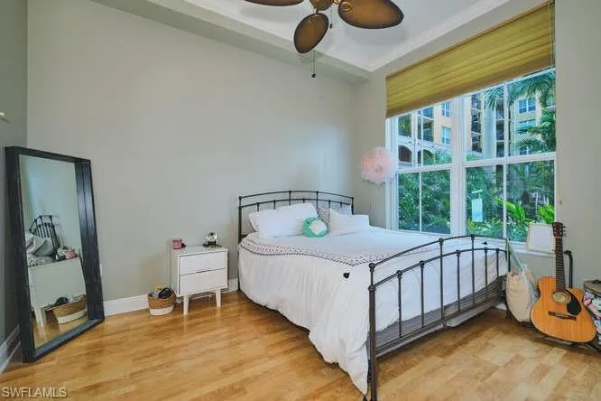 Bedroom with light wood-style floors and ceiling fan