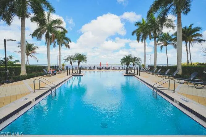 Community pool with a patio area