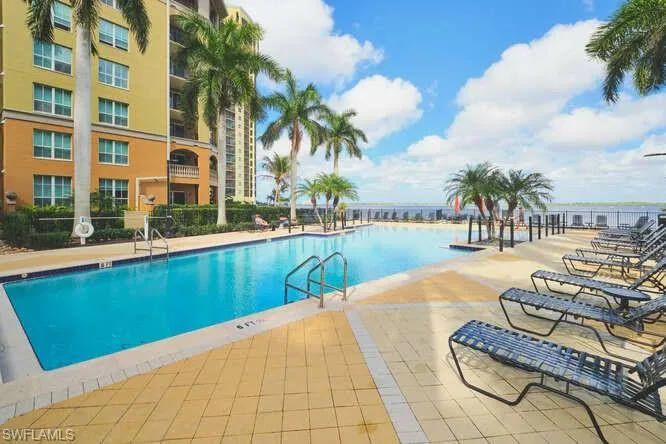 Community pool with a patio