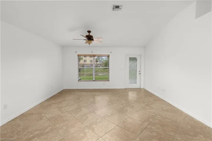 Spare room with ceiling fan