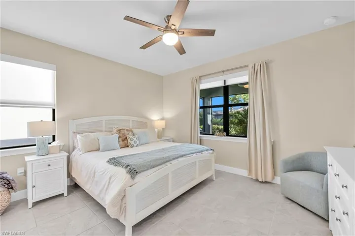 Bedroom featuring a ceiling fan and light tile patterned floors