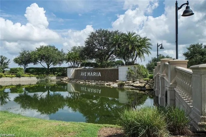Community sign featuring a water view
