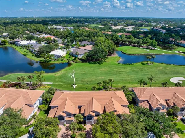 Aerial perspective of condo building featuring Stonebridge golf course and lake