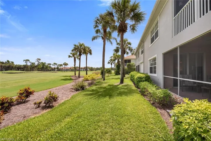 View of community with a yard and view of golf course