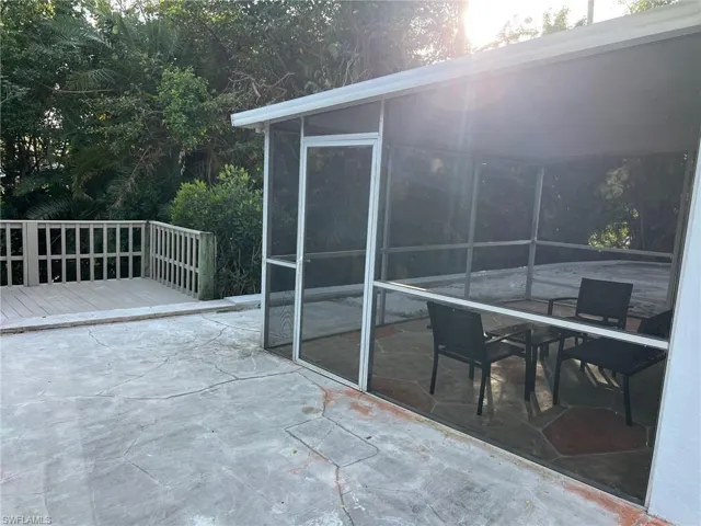 View of patio with a wooden deck