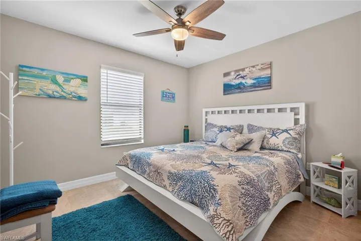 Bedroom with baseboards and a ceiling fan