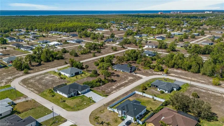 Aerial overview of property's location featuring nearby suburban area