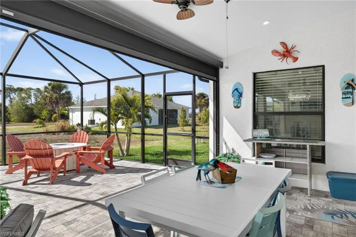 Rear Lanai featuring outdoor dining space, a patio, a ceiling fan
