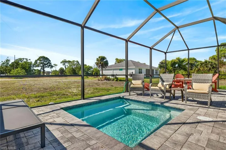 Spa pool with a pavers sundeck and lanai