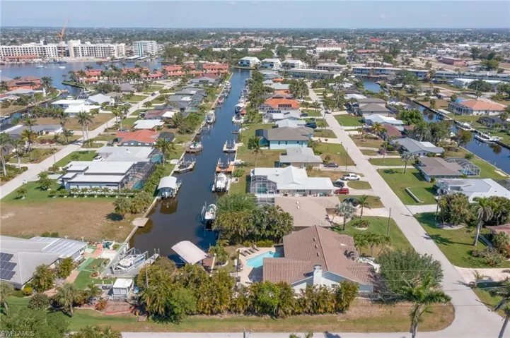 Drone / aerial view with a residential view and a water view