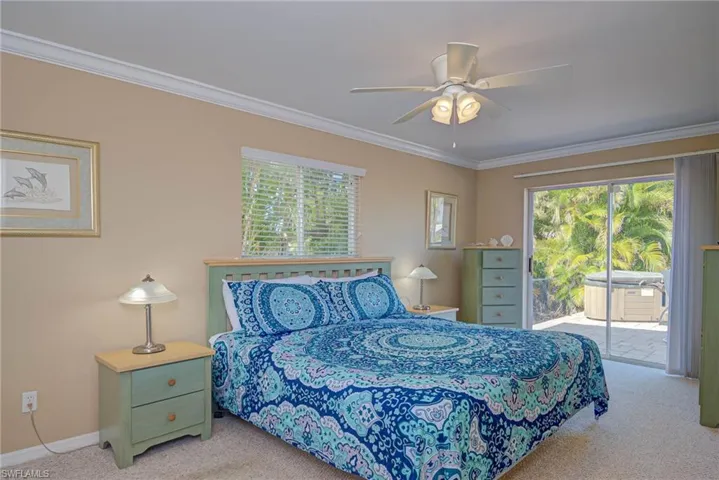 Carpeted bedroom with baseboards, ornamental molding, access to outside, and ceiling fan