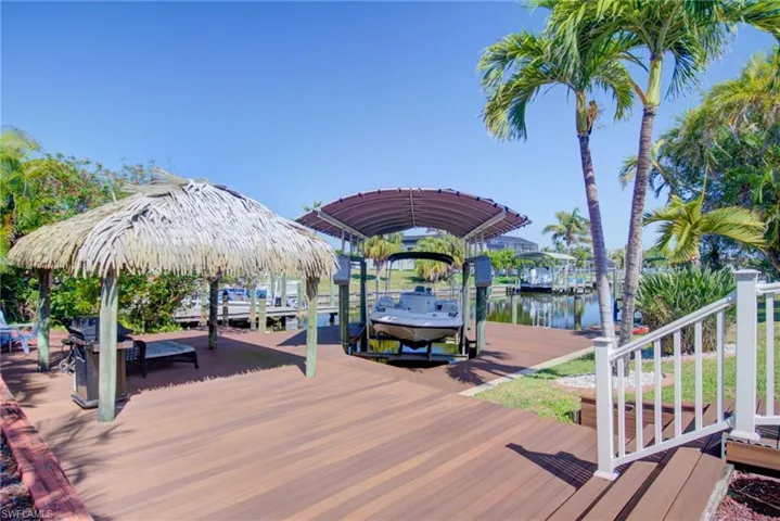 View of dock featuring a water view and boat lift
