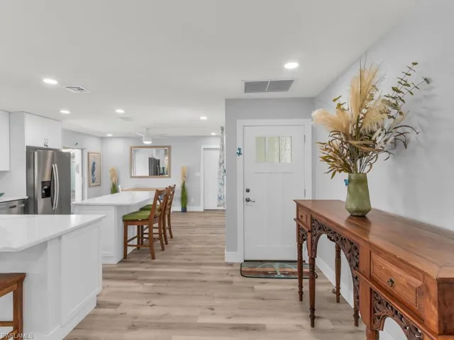 Entrance foyer featuring light wood-type flooring