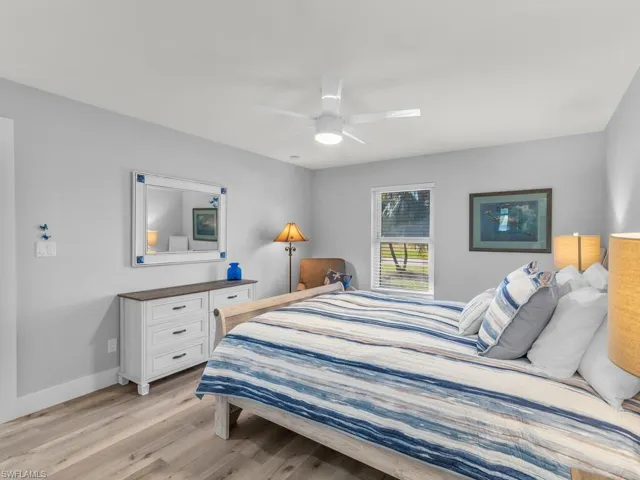 Bedroom featuring ceiling fan and light wood-type flooring