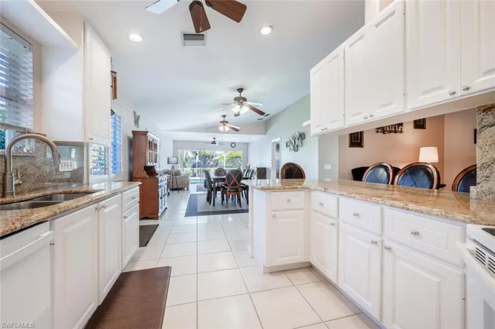 The kitchen has Granite Counter Tops and Plenty of Storage Space.