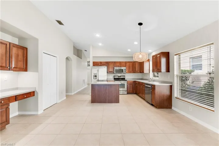 Computer nook and pantry with additional cabinets