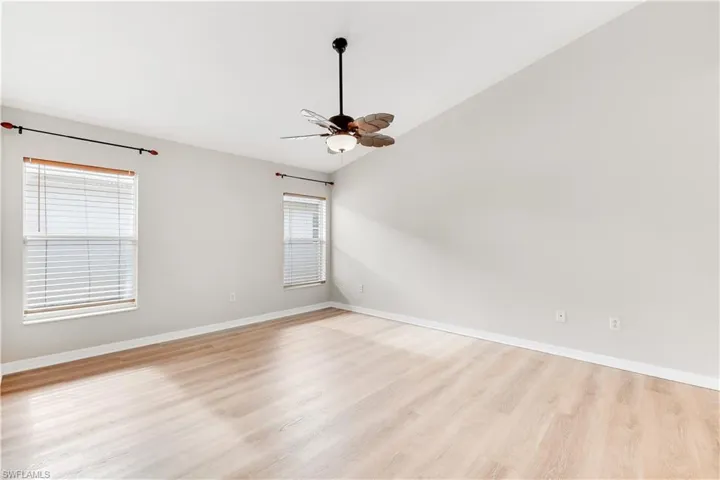 Large Primary Bedroom with wood look laminate flooring