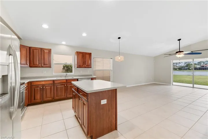 Open Kitchen with newer stainless steel appliances