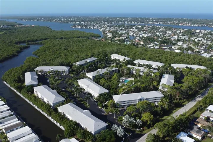 Aerial overview of property's location featuring nearby suburban area