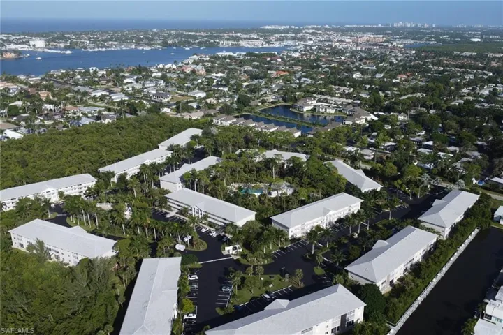 Aerial view of property's location with a nearby body of water