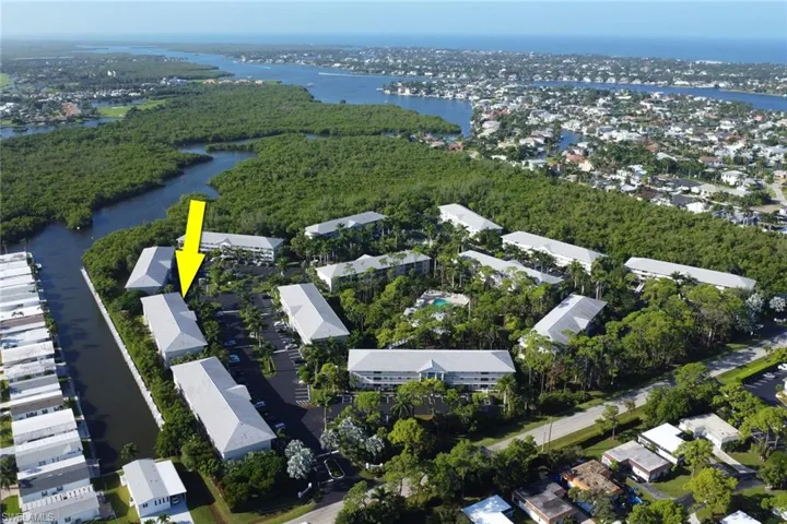 Aerial overview of property's location with nearby suburban area