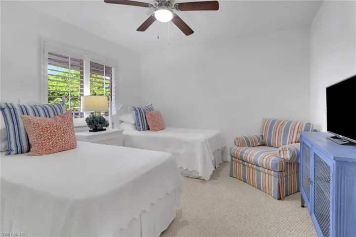 Bedroom with carpet floors and ceiling fan
