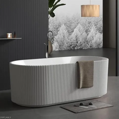 Photos are of a similar home by builder and are for illustrative purposes only. Optional fluted tub can be selected as part of your customized finishes.