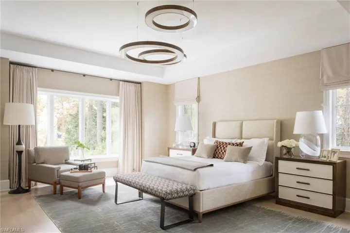 Photos are of a similar home by builder and are for illustrative purposes only. Bedroom featuring light wood-style flooring and baseboards.