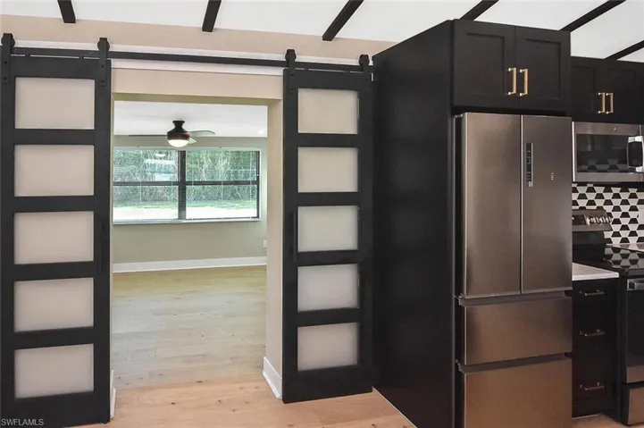 Barn-style doors opened into the second bedroom.