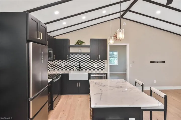 Both ample recessed and pendant lighting illuminate your workspace!