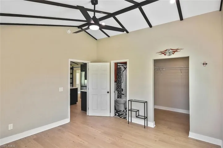 Bedroom features a large walk-in closet adjacent to the bathroom.