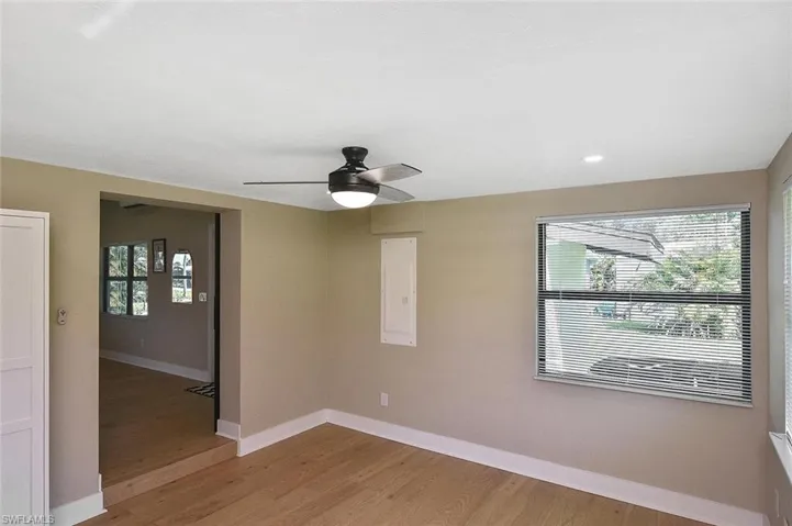 Step down into the second bedroom with four big impact windows that offer abundant natural light from three directions!