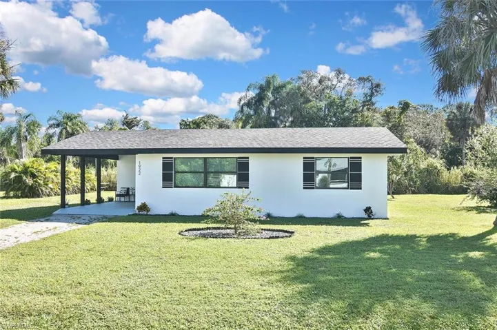 The spacious front lawn will inspire the gardener in you!