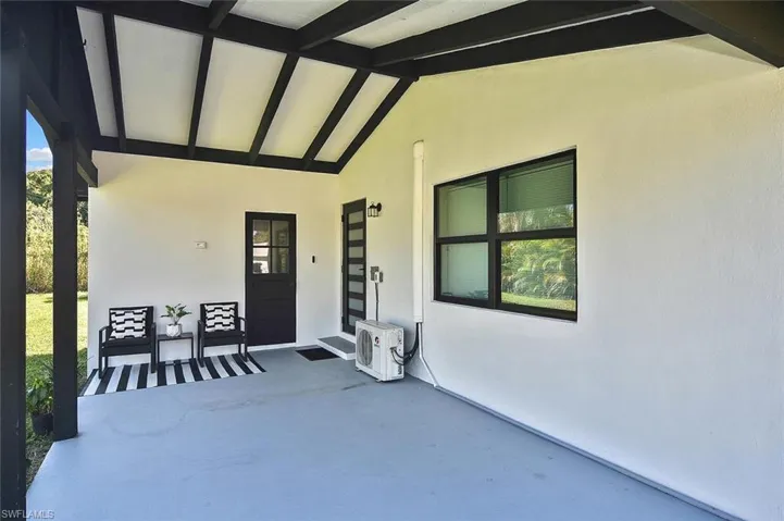 The welcoming carport area provides a shaded spot to sip a cool glass of lemonade!