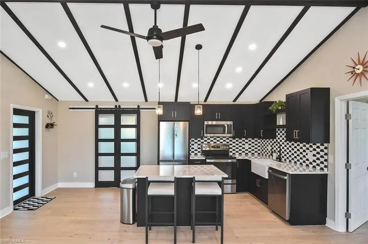 Truly the 'heart of the home,' this kitchen's visual symmetry has both glamour and functionality.
