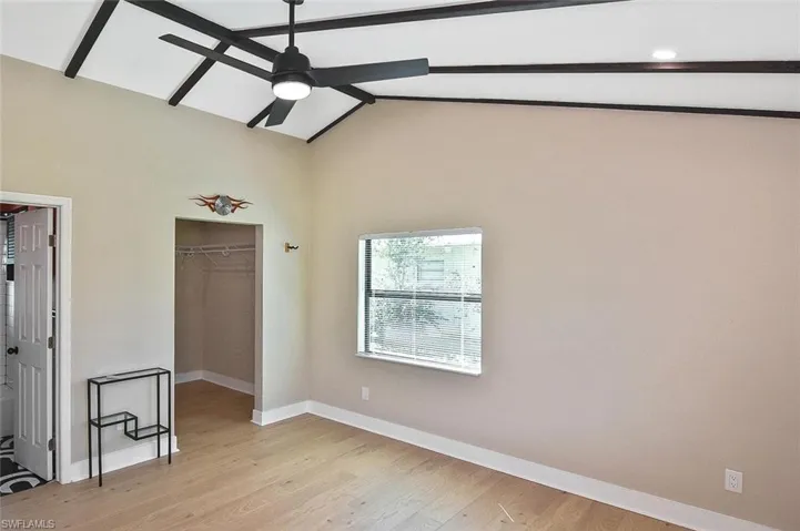The beamed white ceiling is carried into the Owners' Suite as well as the great room.