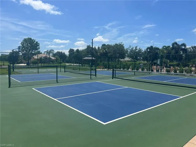 View of tennis court with community basketball court