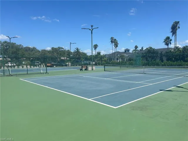 View of tennis court featuring community basketball court