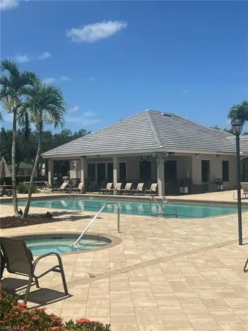Community pool with a patio and a community hot tub
