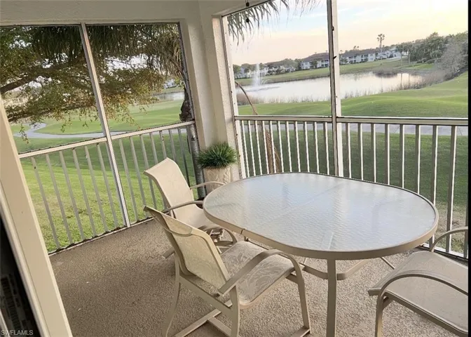 Sunroom / solarium with a water view