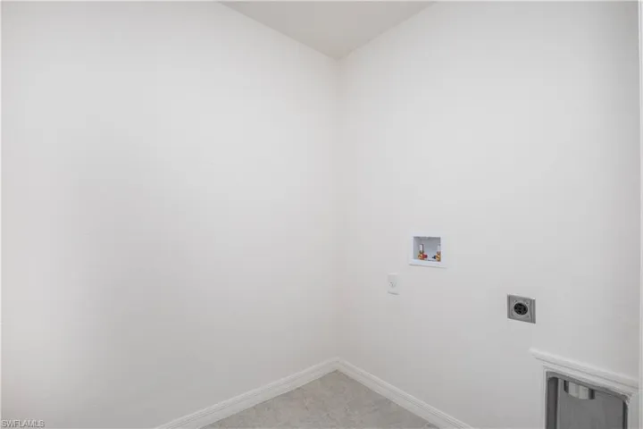 Laundry area with hookup for a washing machine and electric dryer hookup