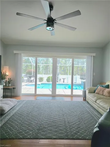 Living room with ceiling fan and wood finished floors