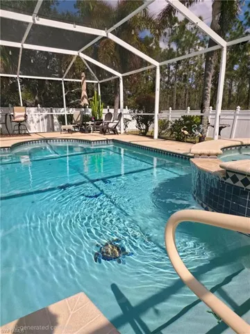 Integrated pool / spa with glass enclosure, a sunroom, and a patio