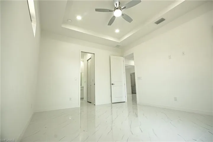 Unfurnished bedroom with recessed lighting, baseboards, and visible vents