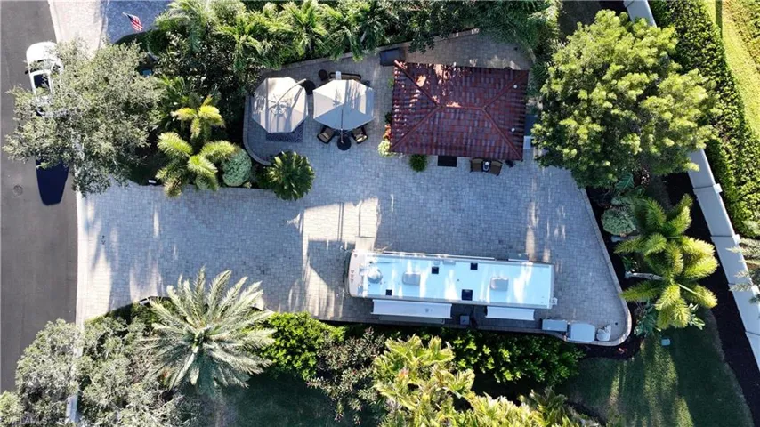 Aerial view of property and surrounding area featuring a pool
